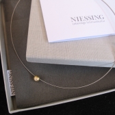 Niessing Schnur mit Kugel u. Brillant, Gold 750/- WG/GG Brill. 0.14ct.